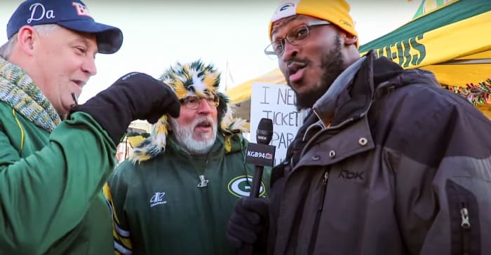 Kabeer Gbaja-Biamila interacts with fans at a Lambeau Field tailgate for a YouTube video